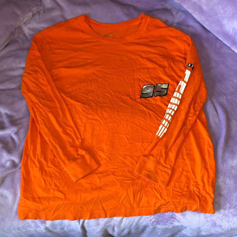 Orange Flirtitude long sleeve shirt.